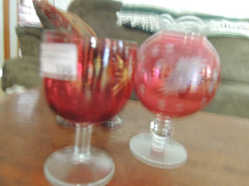 lot 196 image: Cranberry glass vase and thumbprint...