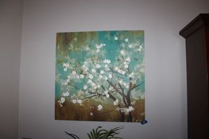 lot 25 image: Canvas wall art with white cherry blossoms