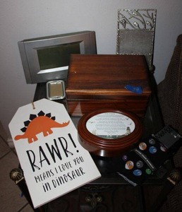 lot 34 image: Misc. lot Atomic wall clock, wooden box and music box, Mens billiard socks, Dino sign