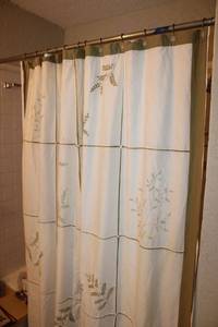lot 52 image: Shower curtain and curtain rod hangers, see photos