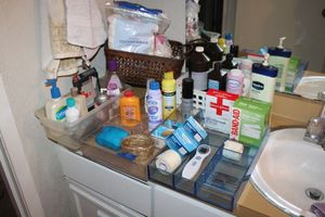 lot 56 image: Bathroom drawer organizers and hygiene items