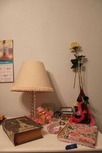 lot 59 image: Pink desk lamp, pink princess piggy bank, book style storage box, pink gem paper weight and more