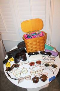 lot 64 image: Eyeglasses and sunglasses (some need repair) with wicker purse