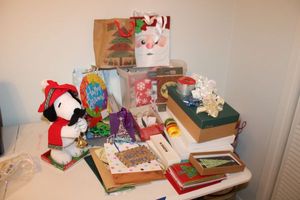 lot 80 image: Christmas gift bags, boxes, greeting cards, and Snoopy figurine