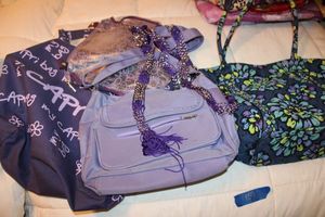 lot 159 image: Purple purses and bags