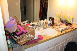 lot 162 image: Womens bathroom items hair dryer, unused makeup brush set, nail polish and more
