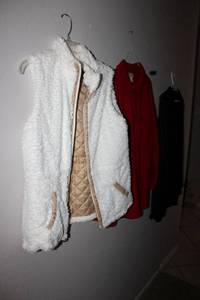 lot 174 image: Womens coats and sweater sleeveless white plush jacket, red button-down coat, and black sweater