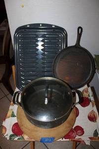 lot 202 image: Kitchen cookware pampered chef pizza stone, cast iron  griddle and more