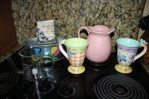 lot 221 image: Butterfly mugs and vases as shown
