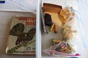 lot 273 image: Ammo Misc. shotgun shells, and The Shooters Bible book