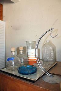 lot 293 image: Vintage glass bottles, glass juicer, and blue glass ashtray