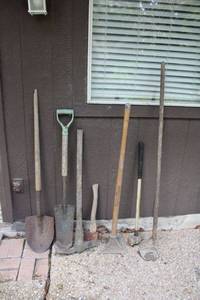 lot 309 image: Yard tools, sledge hammer, tamper, and pick axe
