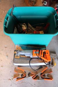 lot 312 image: Chicago brand reciprocating saw, orange clamps, saw blades and Misc. tools