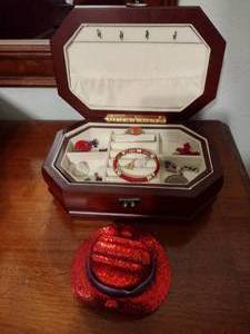 lot 120 image: Jewelry box with jewelry including red hat pieces