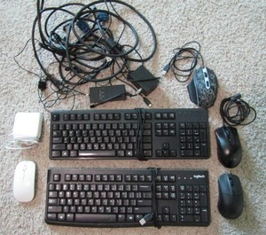 lot 336 image: Assorted computer cords, keyboards, mouses and an apple charge block