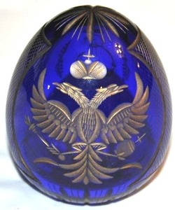 lot 9 image: Faberge Russian Cobalt Blue and Gold glass Egg ... You might want to translate sticker on the egg