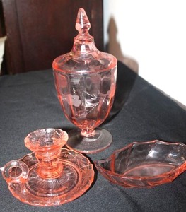 lot 185 image: Vintage Heisey Crystal Twist Flamingo Pink Leaf Shaped Pickle Dish, Vintage Zabkowice Glassworks Pink Depression Candlestick Holder, and Vintage Etched Pink depression Glass Covered Apocrathy Jar