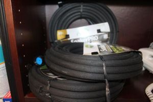 lot 313 image: Three 50 ft Soaker Hoses and Spray Nozzle