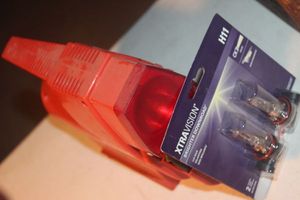 lot 349 image: Unused Auto Headlight Bulbs (H11), and Auto Tire Multi use Compressor
