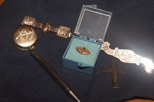 lot 265 image: Gold Toned pen on A Chain clip, collar clips, and Cross pendant, Loyalty Tie Pin with Ruby Stamped 10K