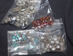 lot 363 image: These are bracelets, or Necklaces that Broke, all pieces are in the bags, each one is a piece that broke