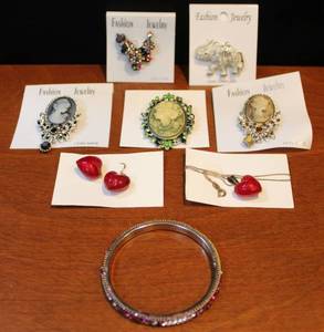 lot 9 image: Brooches and necklace and earrings and bracelet