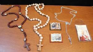lot 13 image: Rosarys and to refrigerator magnets