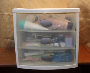 lot 75 image: Three drawer tote full of miscellaneous bathroom items as seen in picture
