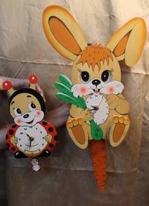 lot 77 image: Would rabbit clock and wood ladybug clock