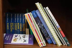 lot 109 image: Lot of traveling books and more see pictures