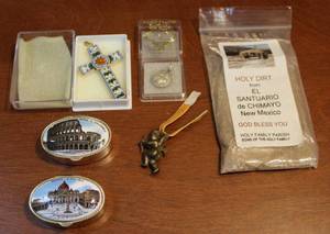 lot 111 image: Two pendants one is Sterling silver and holy dirt and more see photo