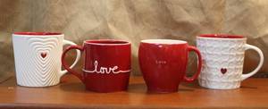lot 117 image: For Starbucks coffee cups two with hearts and two that say love