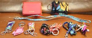 lot 135 image: Vera Bradley keychains and Vera Bradley straps and a few Vera Bradleys