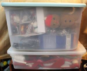 lot 195 image: 2 totes full of Christmas items one tots is full of Christmas stockings and more  the other is a mixed lot Christmas ornaments lights and much more