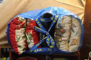 lot 208 image: Ikea bag full of throw pillows took pictures of each