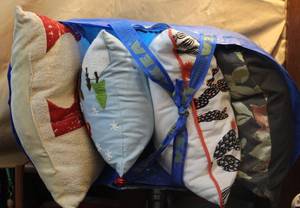 lot 209 image: Ikea bag full of throw pillows took pictures of each
