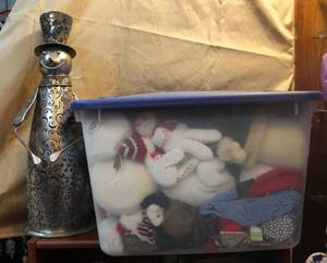 lot 211 image: Lot of Christmas things about a 2 ft tall metal snowman and a tote full of plushies and much more got pictures of everything in tote