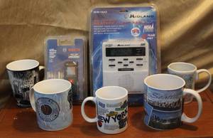 lot 214 image: Weather alert radio unopened and Bosch laser measure unopened and a hand full of coffee cups