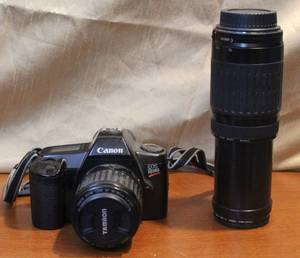 lot 216 image: Canon EOS REBEL AND EXTRA LENS THAT ZOOM FROM 75-300MM