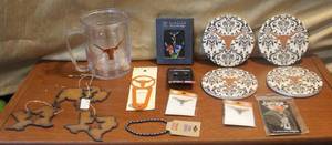 lot 230 image: Longhorn lot  cup coasters book mark and much more also 2 metal Texas ornament and a metal Buffalo ornament
