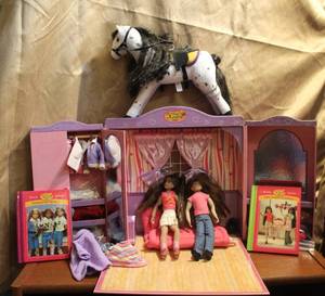 lot 250 image: Dolls with little pop out house and horse and two books