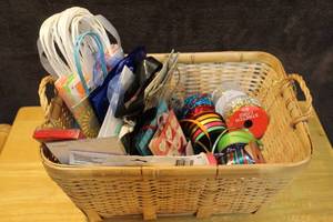 lot 297 image: Basket full of gift bags ribbon and more see photos