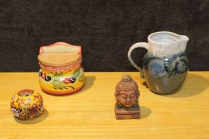 lot 383 image: Hand made pitcher Buddha head and  candle holder and more see pictures