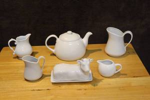 lot 399 image: Teapot cow butter dish creamer and more see photo