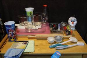lot 421 image: Kitchen lot with cutting boards glass measuring cups rolling pin utensils and more see photos