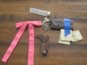 lot 54 image: PINK BOWTIE, BOOT KEY CHAIN, KEYCHAIN, & COIN TUBE
