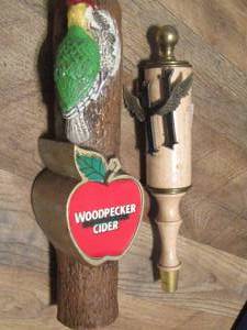 lot 74 image: WOODPECKER CIDER AND HEINEKEN BEER TAP HANDLES