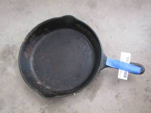 lot 105 image: Wagner Ware  10 cast iron skillet ,