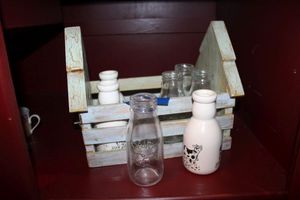lot 69 image: Decorative wooden milk crate with milk bottles