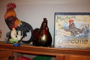 lot 51 image: Rooster figurines and tin